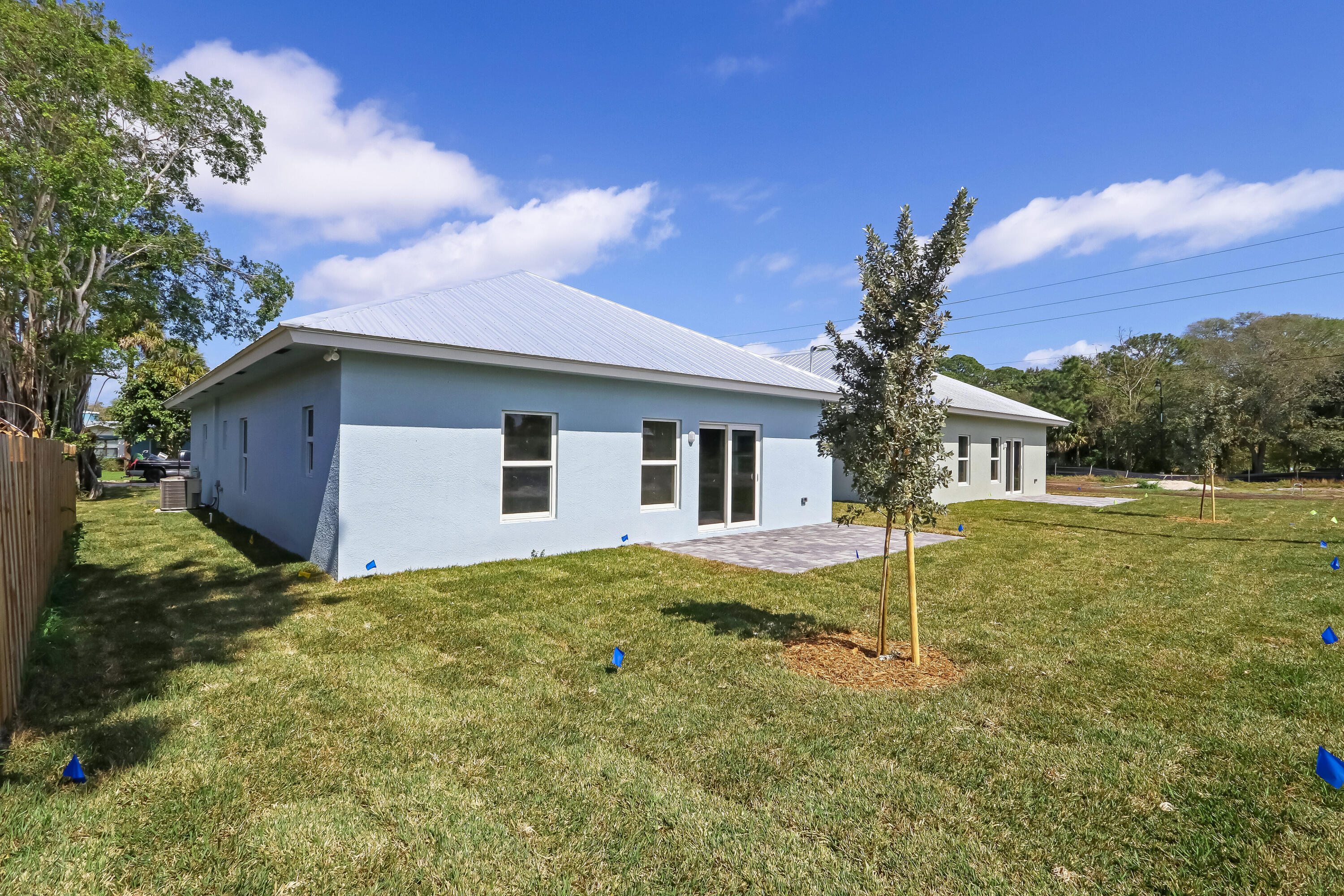 936 Southeast 6th Street Stuart, FL 34994 - Photo 7 of 25 a house with trees in the background