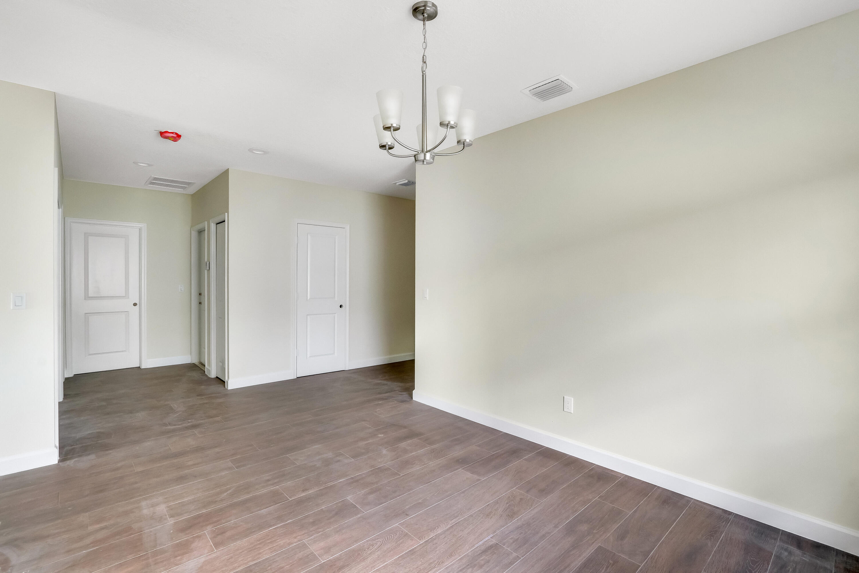 936 Southeast 6th Street Stuart, FL 34994 - Photo 8 of 25 a view of an empty room with a window