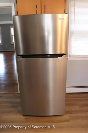 a bathroom with a shower and a toilet