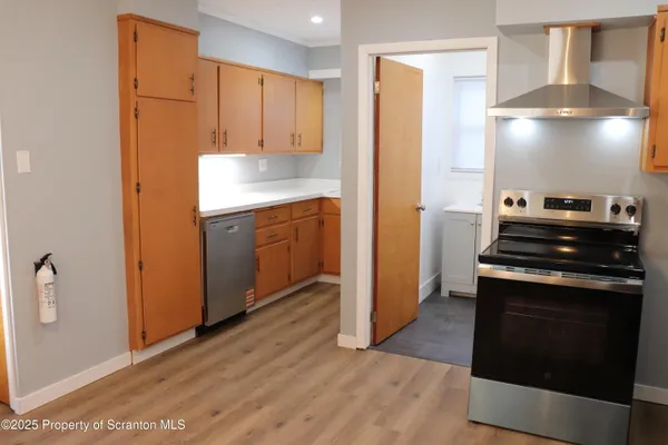 a kitchen with granite countertop a stove and a refrigerator