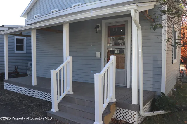 a front view of a house with a porch