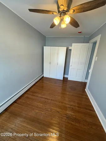 a front view of a house with wooden fence