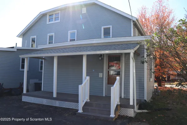 a view of a cars parked in a yard
