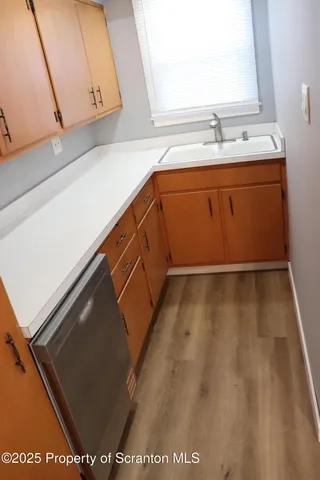 a close view of sink and cabinets
