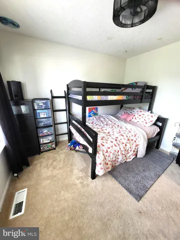 a view of living room with furniture and a flat screen tv