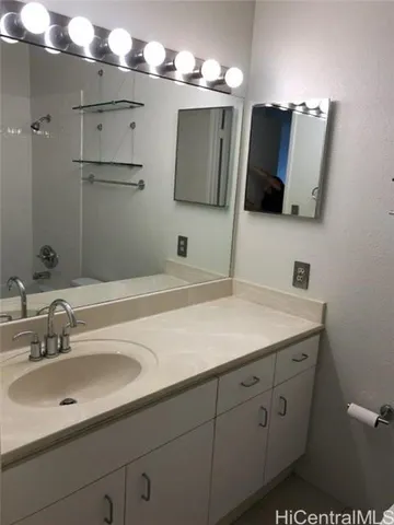 a bathroom with a sink and a mirror