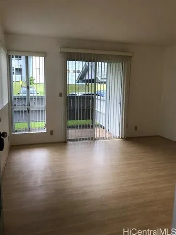 a view of a room with large windows