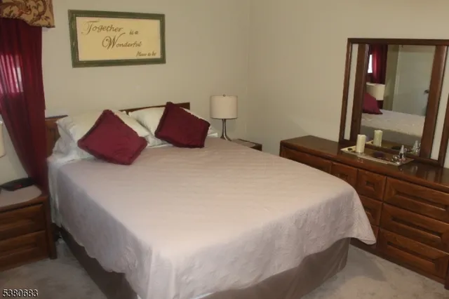 a bedroom with bed and window