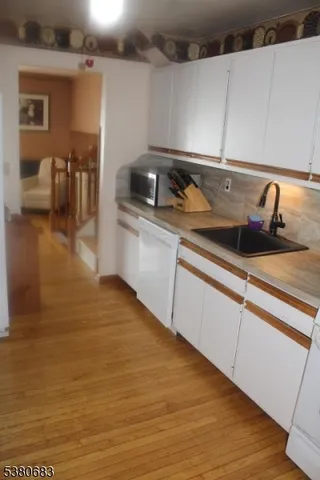 a kitchen with a refrigerator and a stove