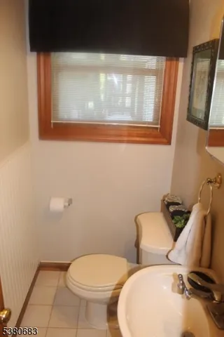 a bathroom with a sink vanity and mirror