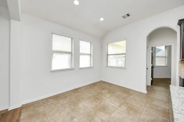 an empty room with windows