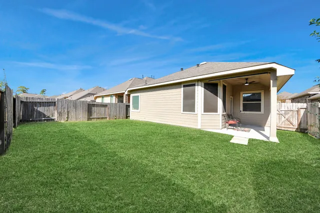 a view of a backyard of the house