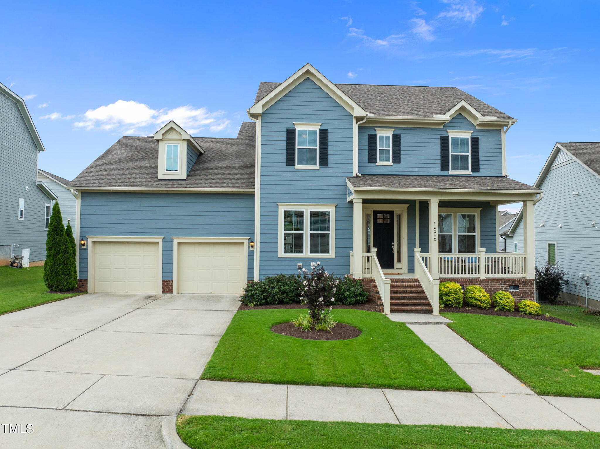 1606 Spring Overlook Lane Hillsborough, NC 27278 - Photo 1 of 56 a front view of a house with garden