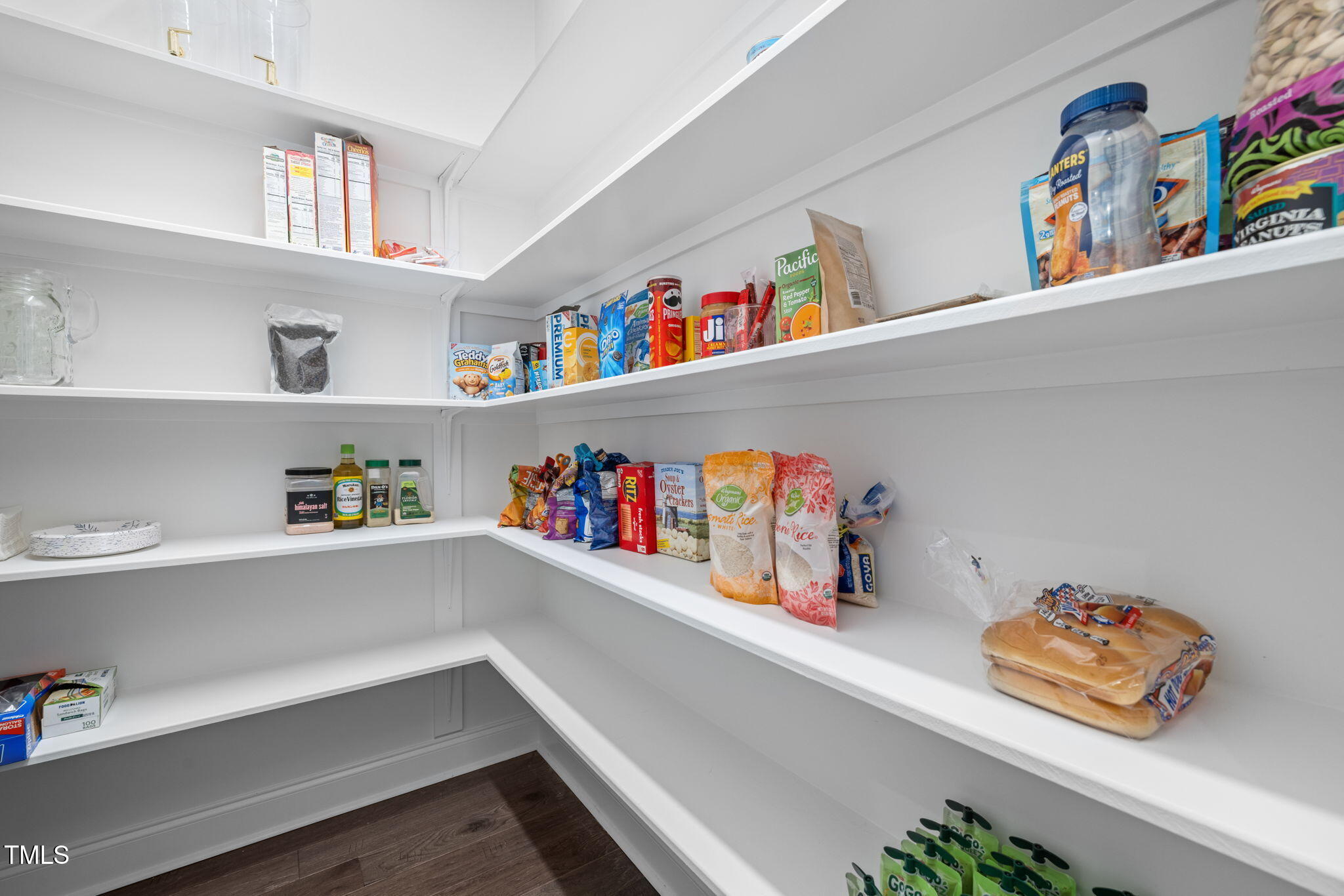 1606 Spring Overlook Lane Hillsborough, NC 27278 - Photo 19 of 56 a cabinet with a book shelf and a book shelf