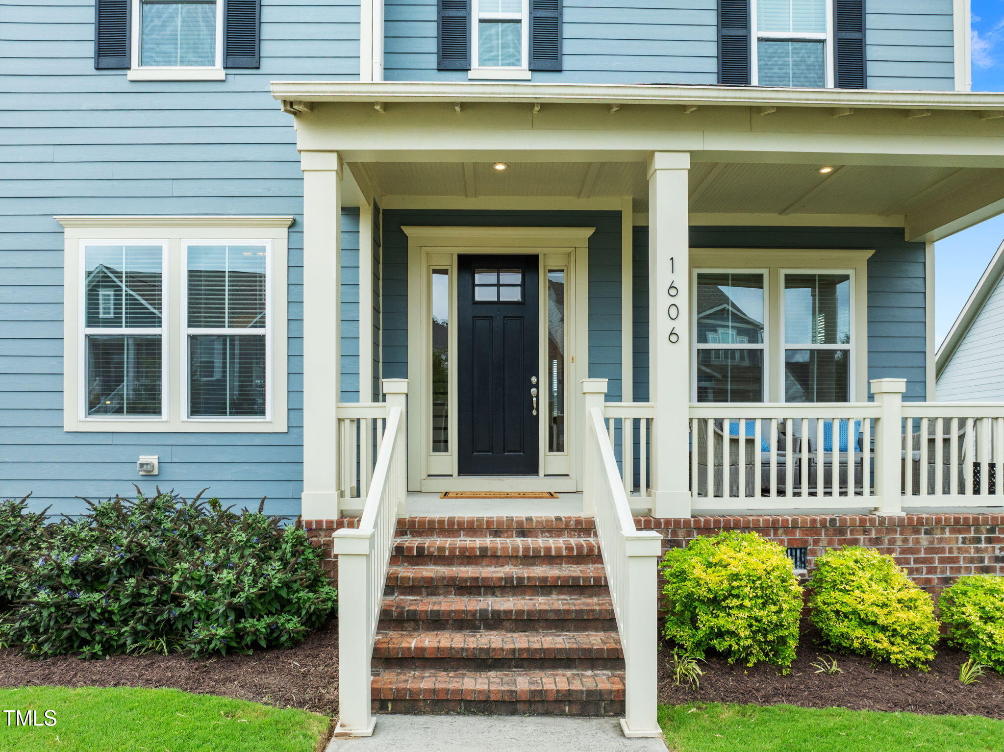 1606 Spring Overlook Lane Hillsborough, NC 27278 - Photo 2 of 56 a front view of a house with a garden