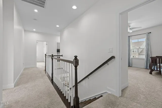a large bathroom with a granite countertop sink double vanity and a mirror