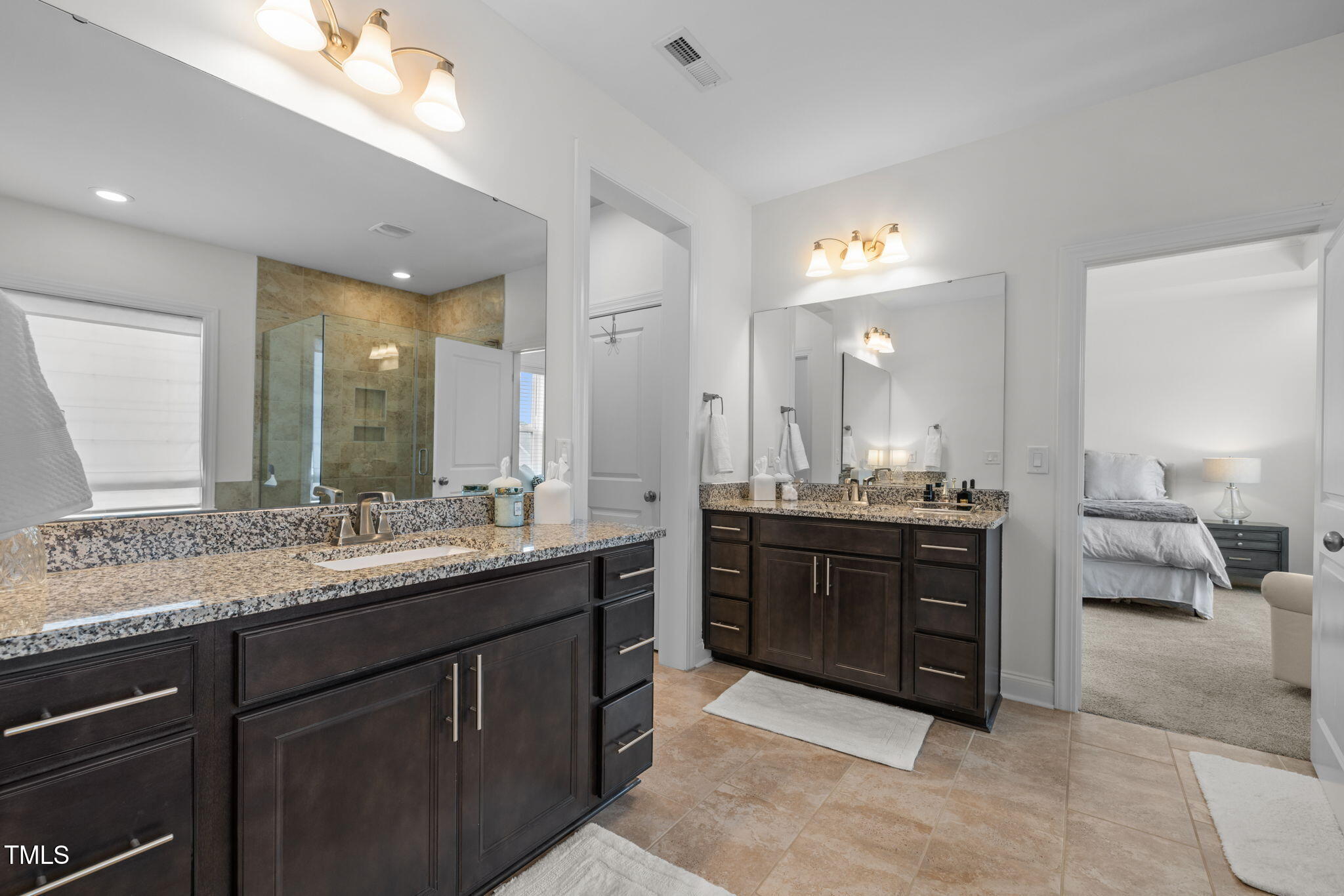 1606 Spring Overlook Lane Hillsborough, NC 27278 - Photo 30 of 56 a large bathroom with a granite countertop sink double vanity and a mirror