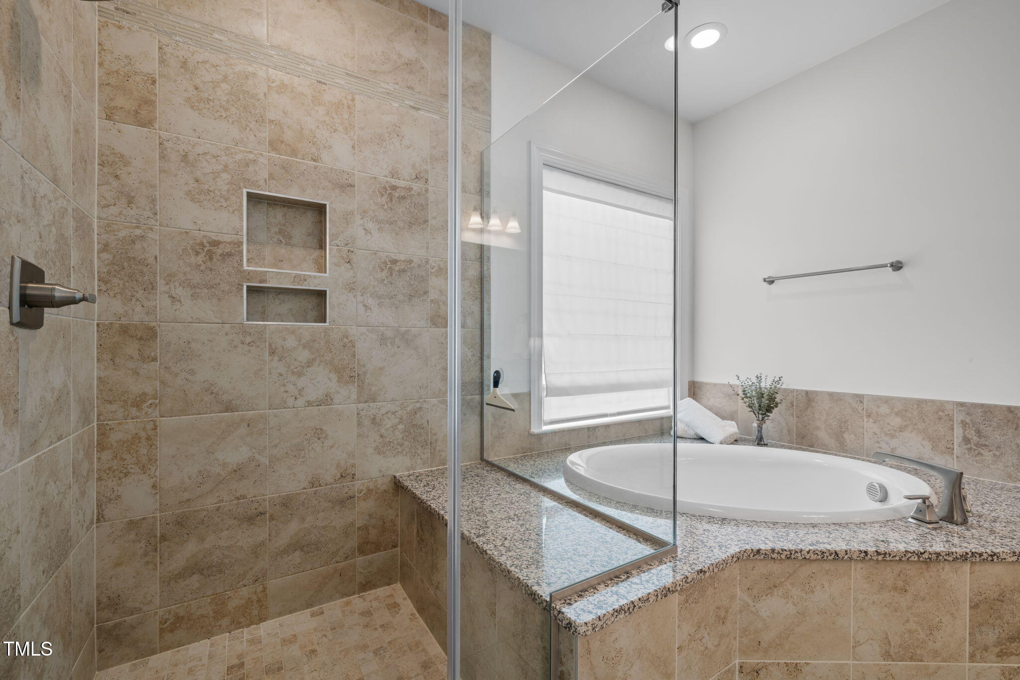 1606 Spring Overlook Lane Hillsborough, NC 27278 - Photo 32 of 56 a bath tub sitting next to a bathroom sink