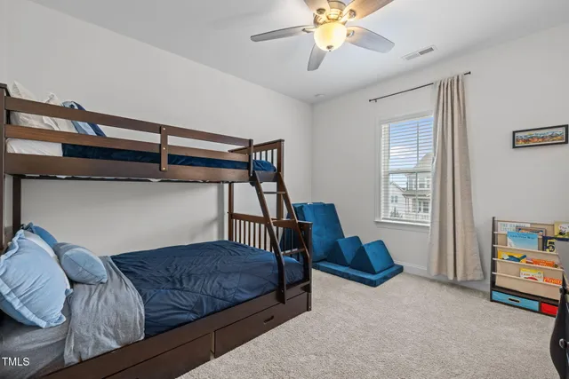 a bedroom with bed and a flat screen tv