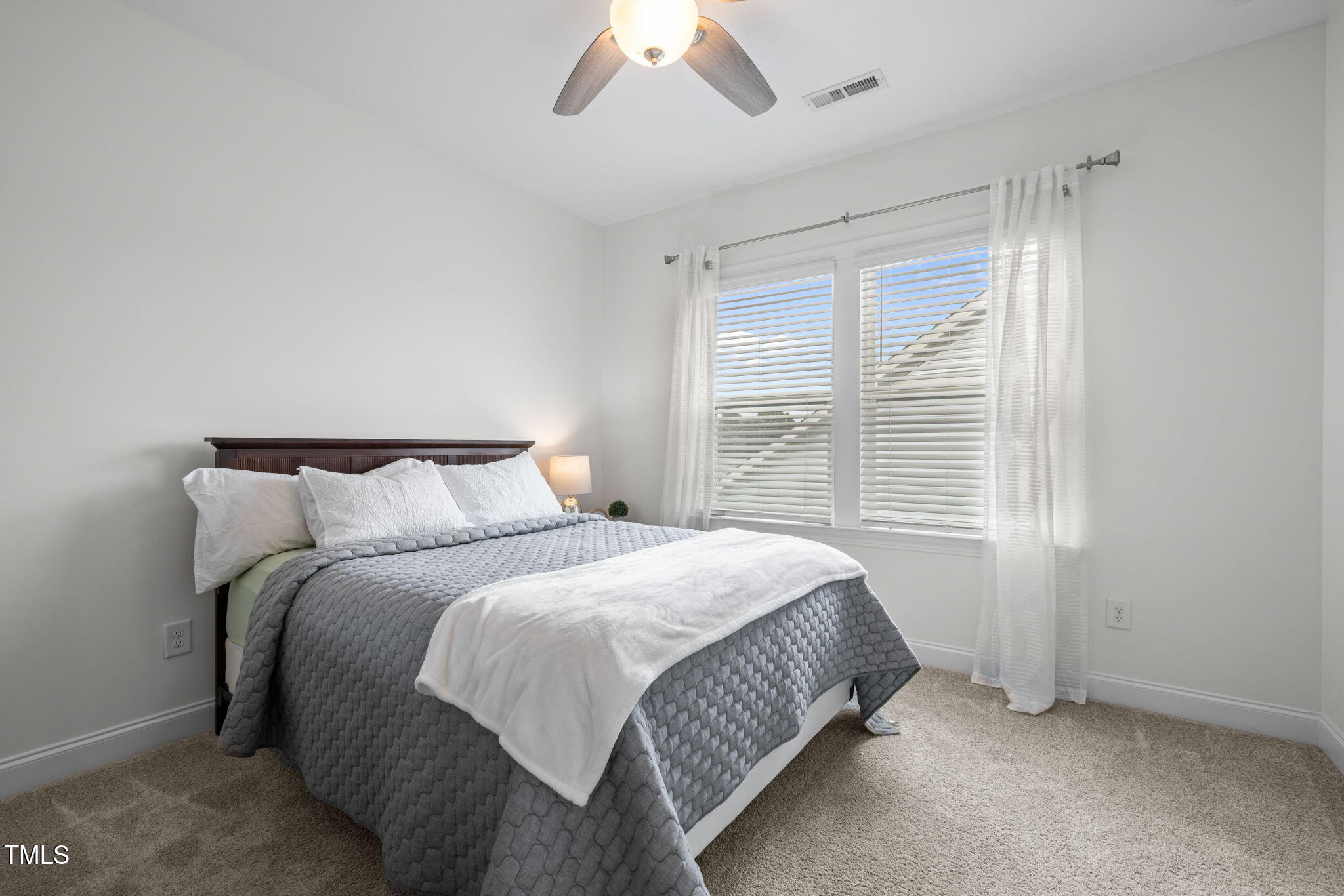 1606 Spring Overlook Lane Hillsborough, NC 27278 - Photo 38 of 56 a bedroom with a bed and a window