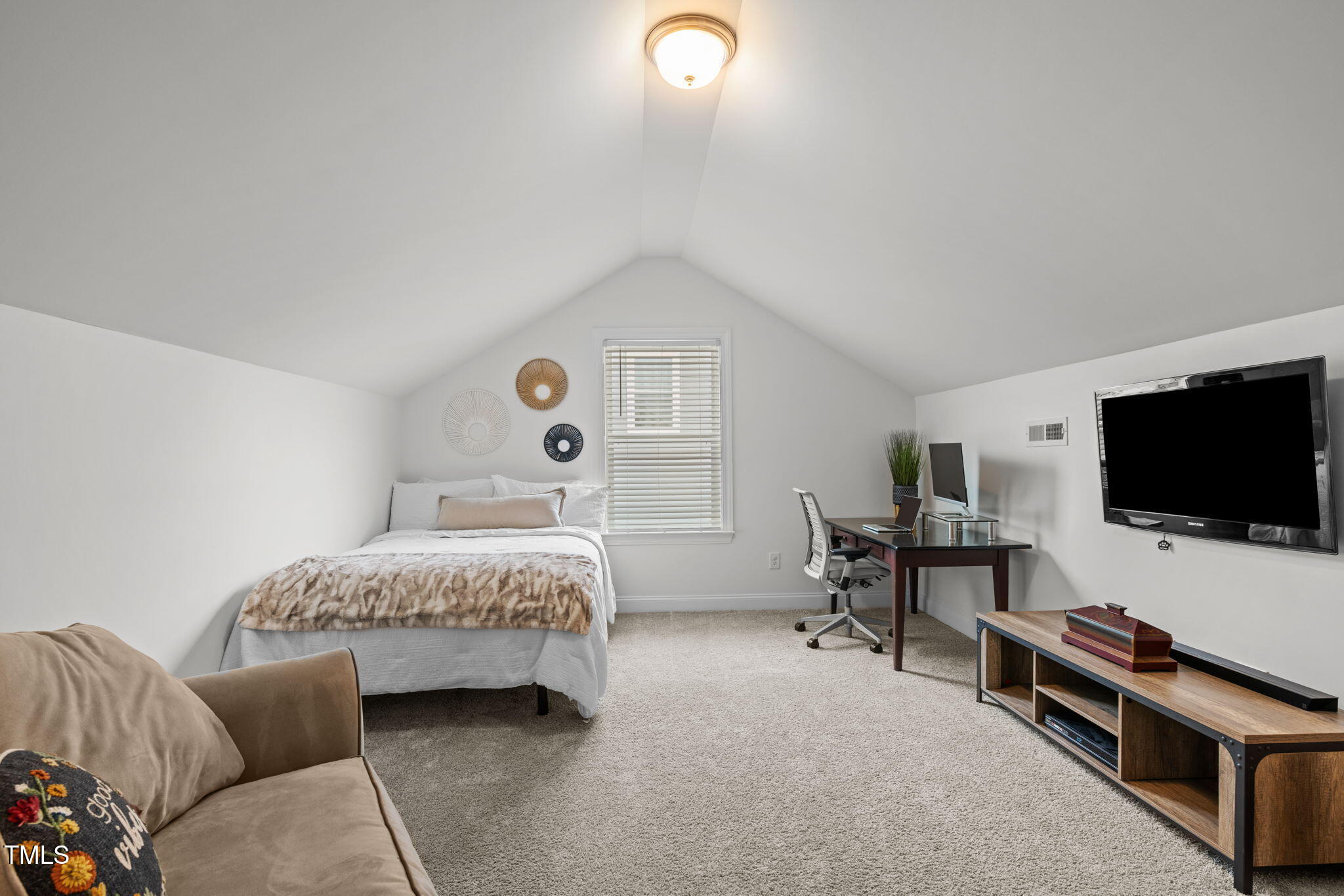 1606 Spring Overlook Lane Hillsborough, NC 27278 - Photo 39 of 56 a bedroom with bed and a flat screen tv