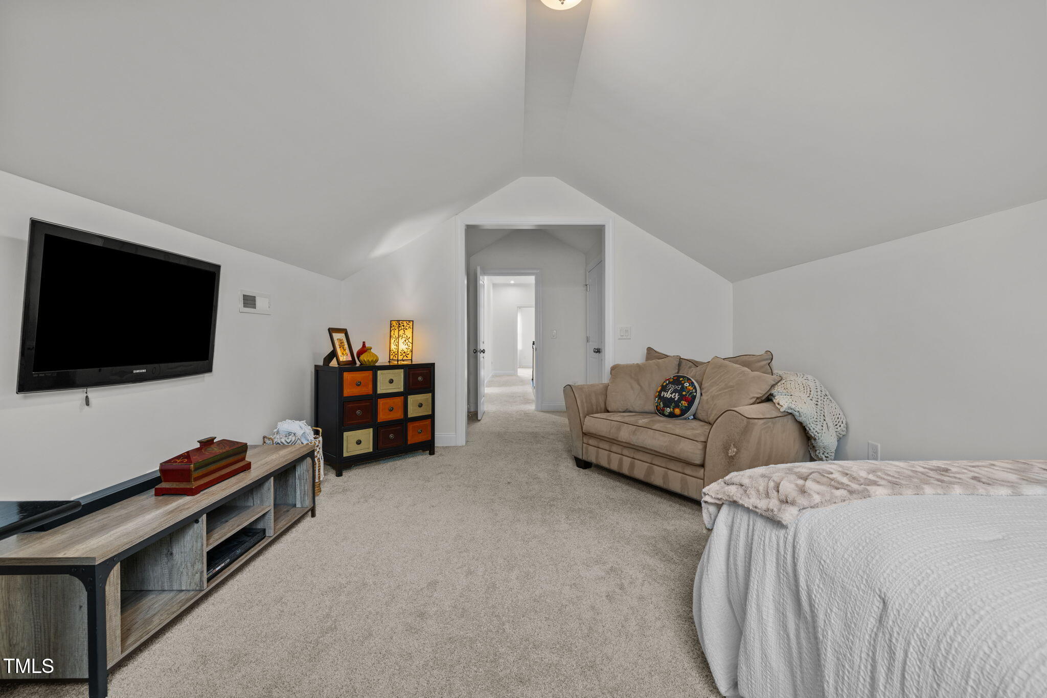 1606 Spring Overlook Lane Hillsborough, NC 27278 - Photo 40 of 56 a living room with furniture and a flat screen tv