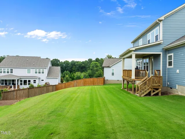 an aerial view of a house with a garden