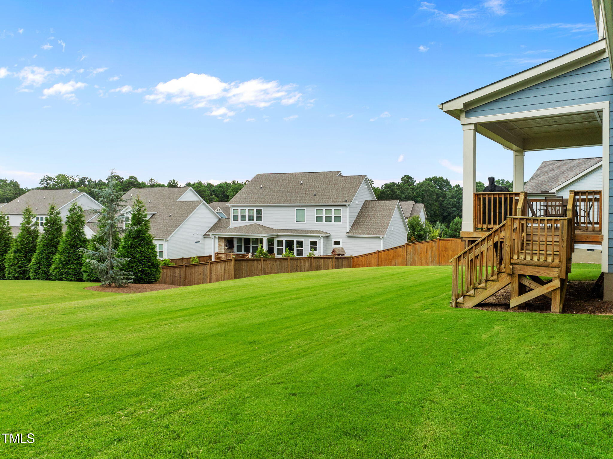 1606 Spring Overlook Lane Hillsborough, NC 27278 - Photo 48 of 56 a view of a house with a backyard porch and sitting area