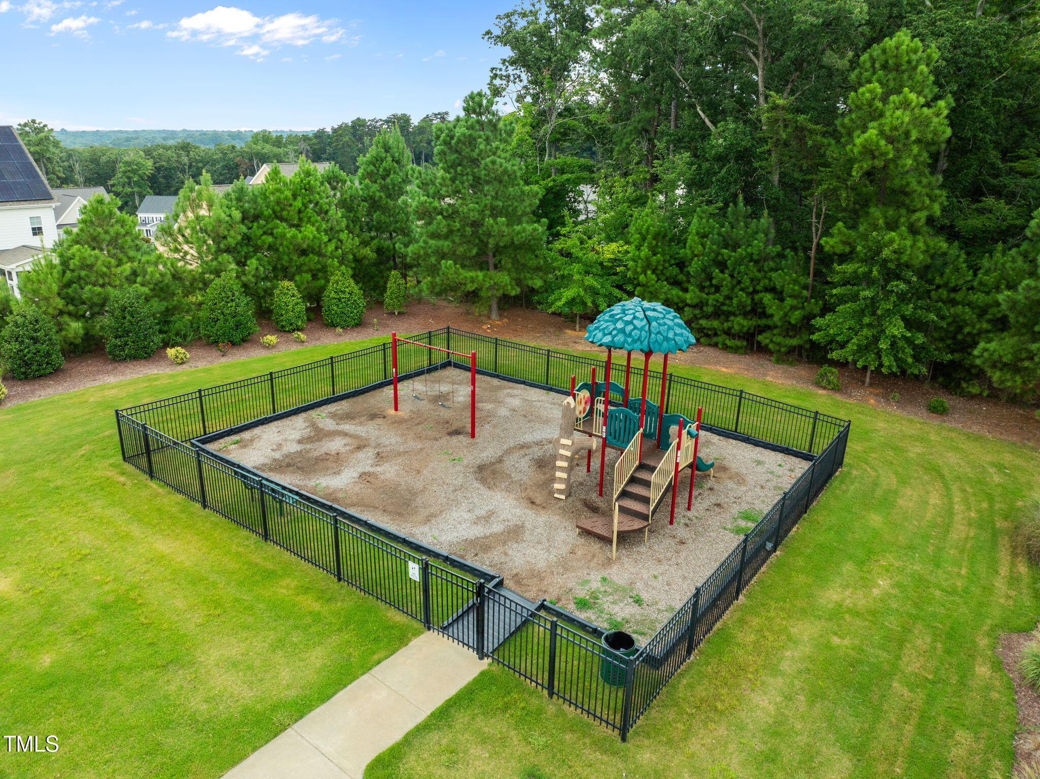 1606 Spring Overlook Lane Hillsborough, NC 27278 - Photo 54 of 56 a view of a backyard with sitting area
