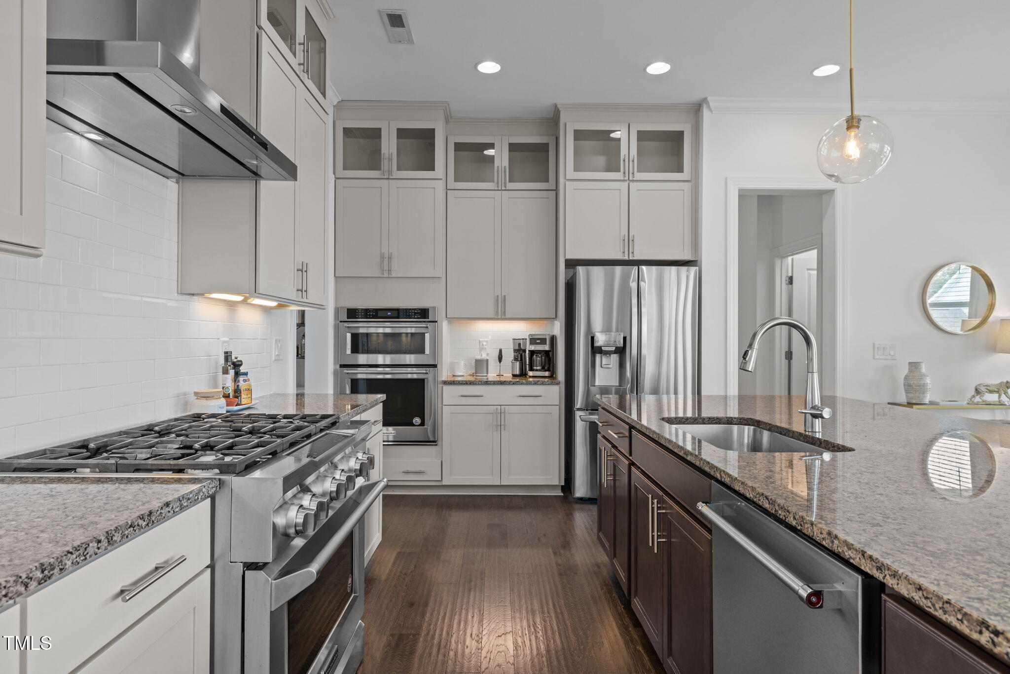 1606 Spring Overlook Lane Hillsborough, NC 27278 - Photo 9 of 56 a kitchen with a sink stove and refrigerator