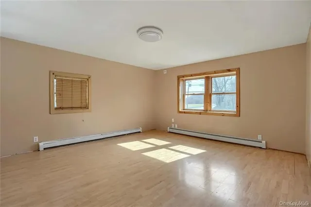 a view of an empty room with windows