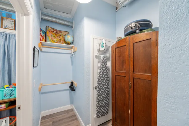 a living room with furniture and next to a window