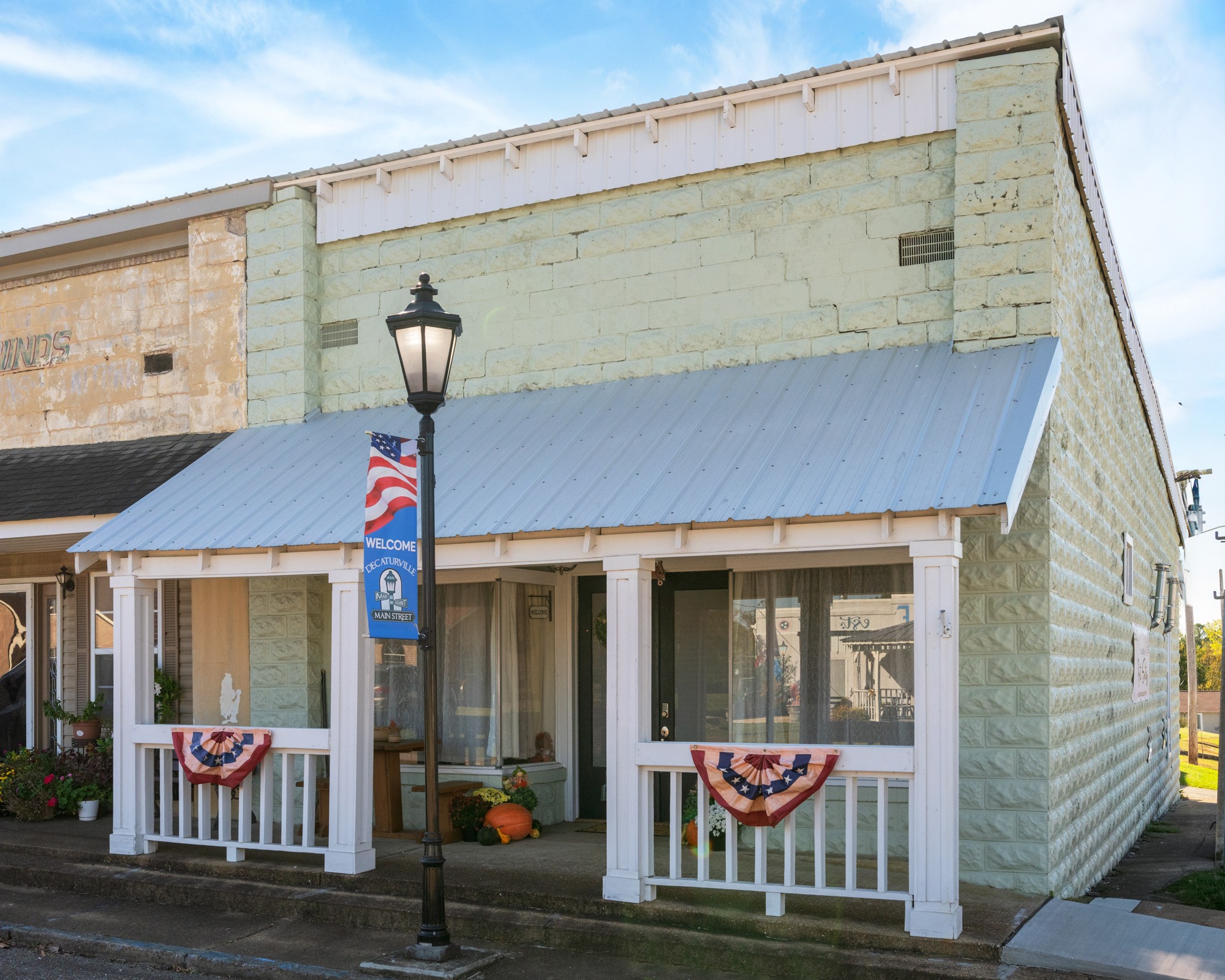 8 East Main Street Decaturville, TN 38329 - Photo 2 of 27 a front view of a house with a glass door