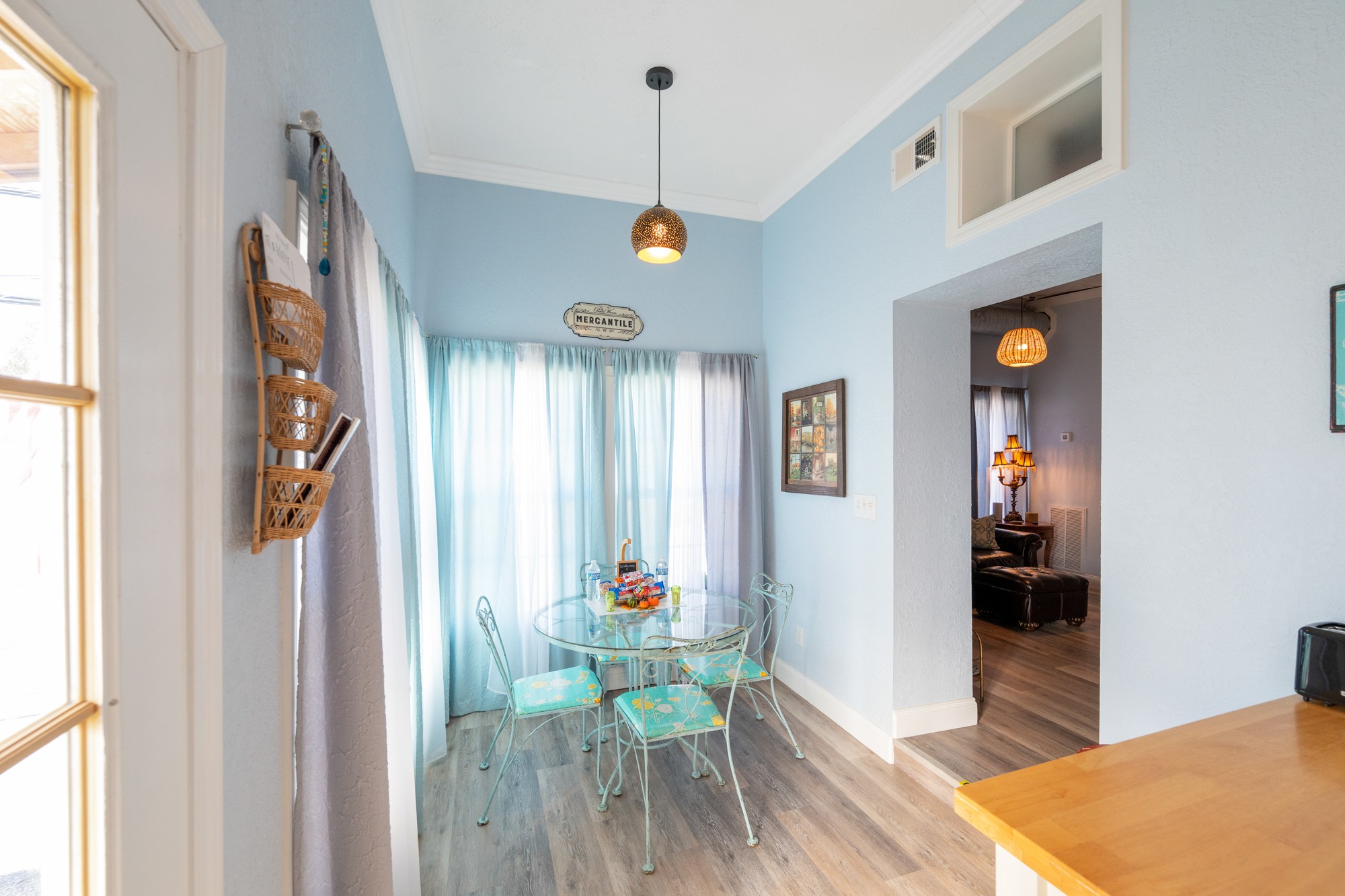 8 East Main Street Decaturville, TN 38329 - Photo 21 of 27 a view of a hallway that has a dining table and chairs