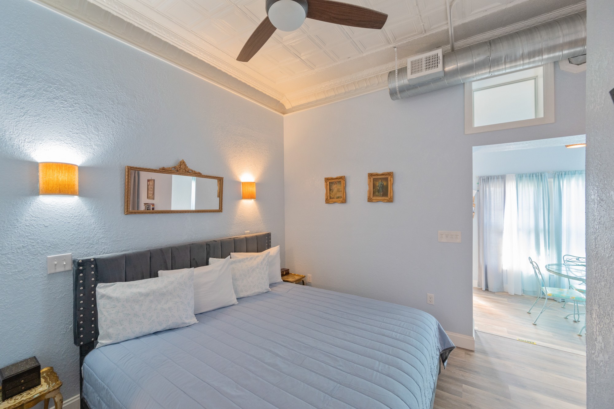 8 East Main Street Decaturville, TN 38329 - Photo 25 of 27 a bedroom with a bed and a lamp on the dresser