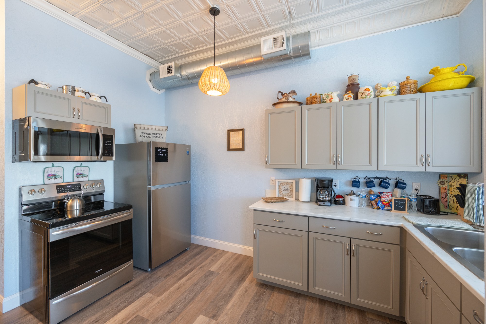 8 East Main Street Decaturville, TN 38329 - Photo 6 of 27 a kitchen with a sink cabinets and stainless steel appliances