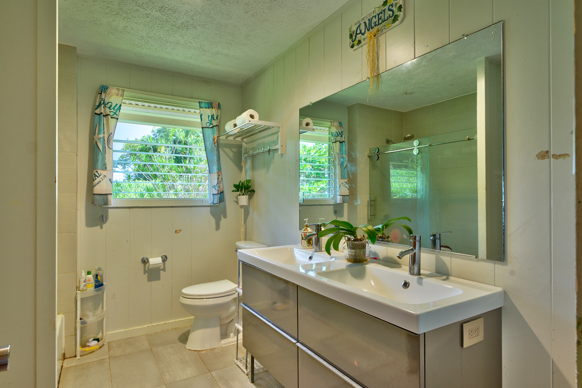 82-1019 KOA Road Captain Cook, HI 96704 - Photo 11 of 17 a bathroom with a sink a toilet and shower