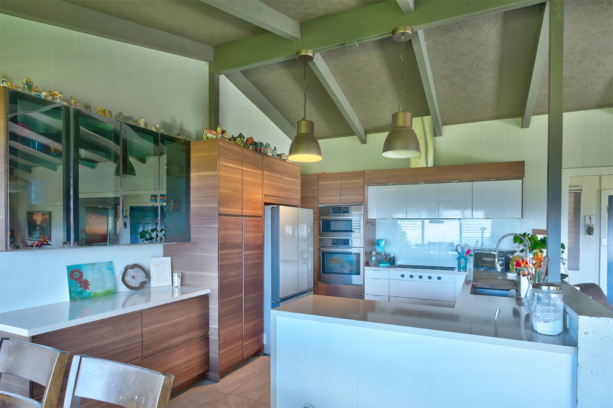 82-1019 KOA Road Captain Cook, HI 96704 - Photo 5 of 19 a kitchen with stainless steel appliances kitchen island granite countertop a sink and cabinets