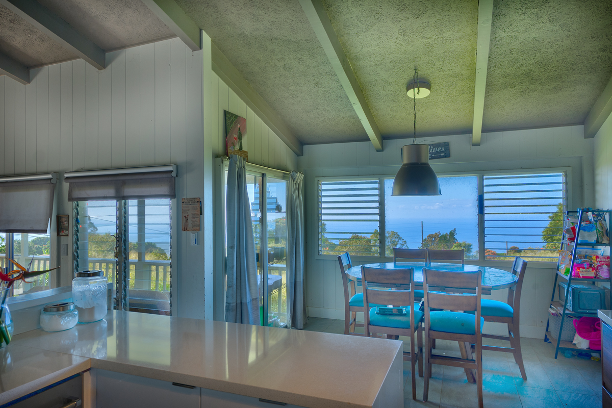 82-1019 KOA Road Captain Cook, HI 96704 - Photo 7 of 19 a view of a dining room with furniture and wooden floor