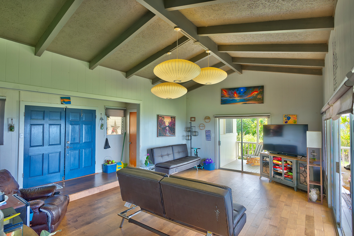 82-1019 KOA Road Captain Cook, HI 96704 - Photo 7 of 17 a living room with furniture and a flat screen tv
