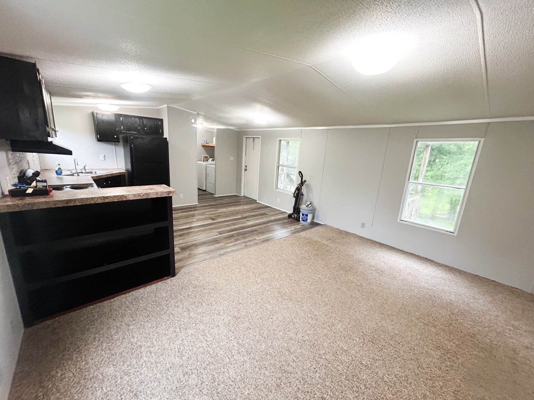 398 2nd Street Big Sandy, TN 38221 - Photo 15 of 26 a view of a room with cabinet flat screen tv and windows