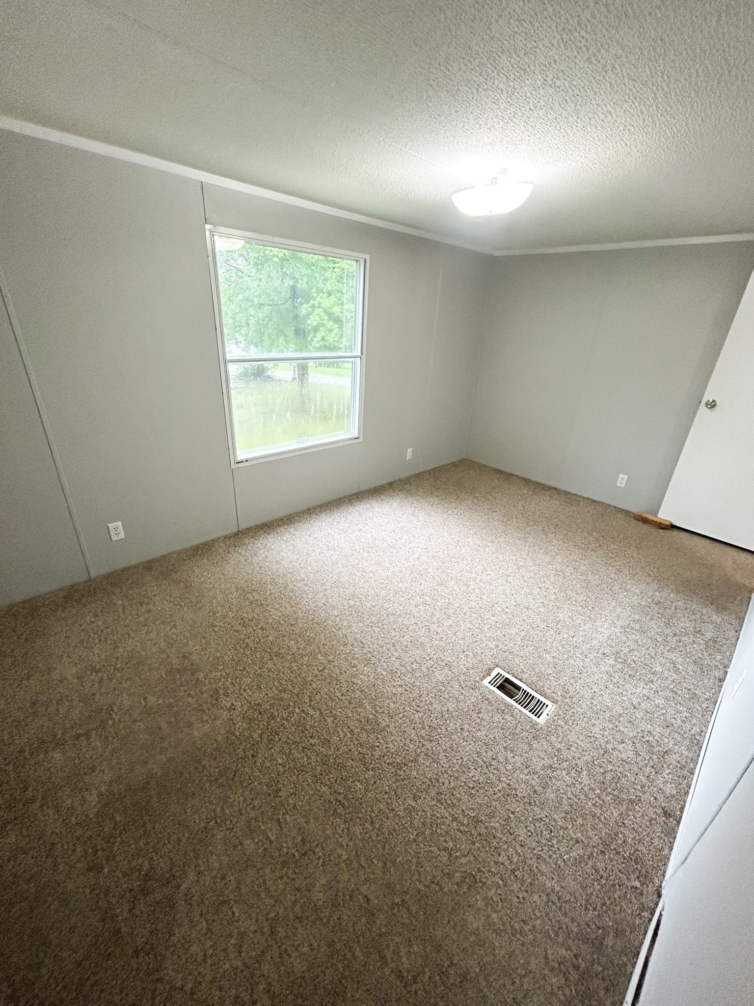 398 2nd Street Big Sandy, TN 38221 - Photo 17 of 26 an empty room with a window