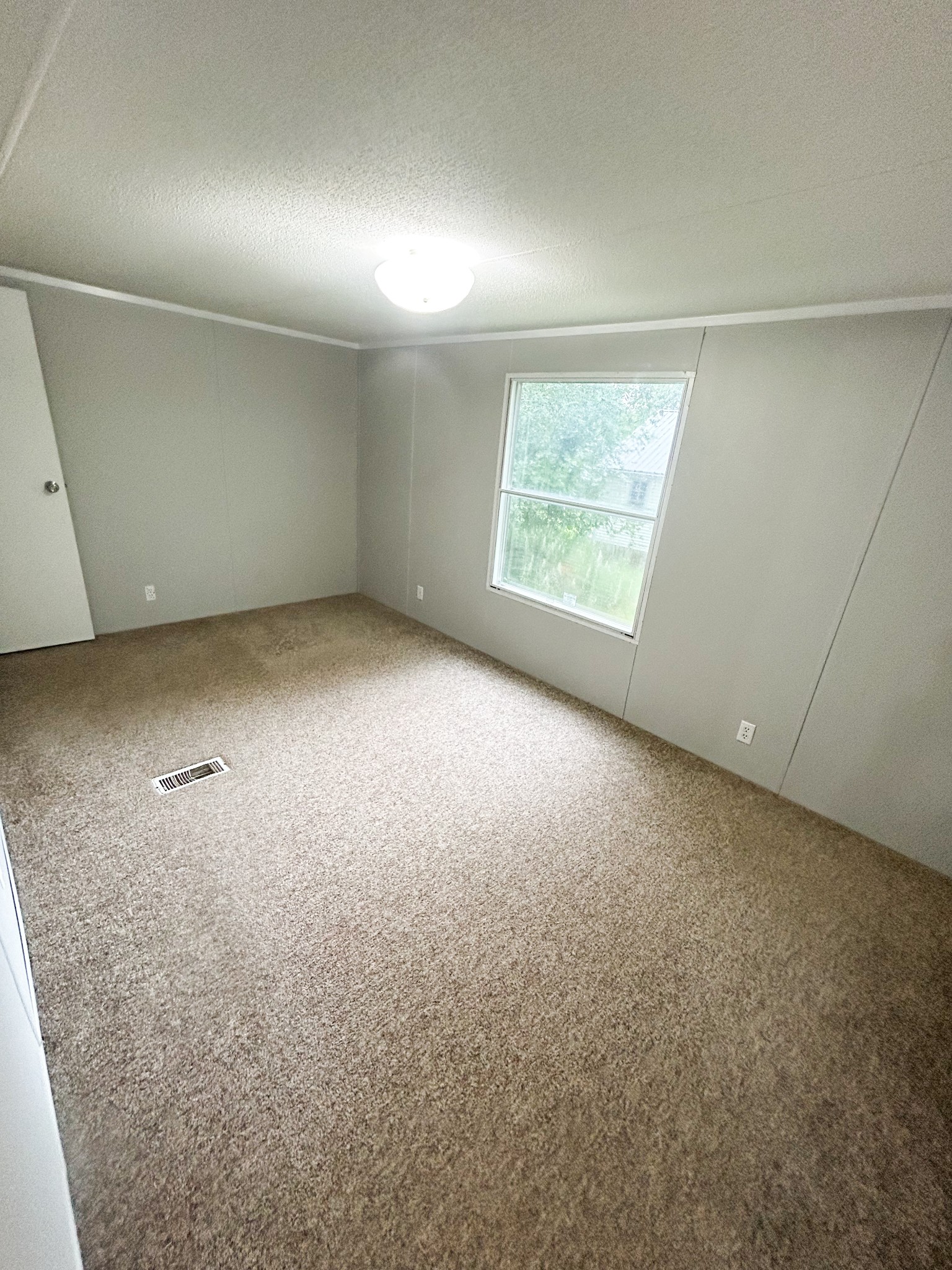 398 2nd Street Big Sandy, TN 38221 - Photo 18 of 26 an empty room with windows