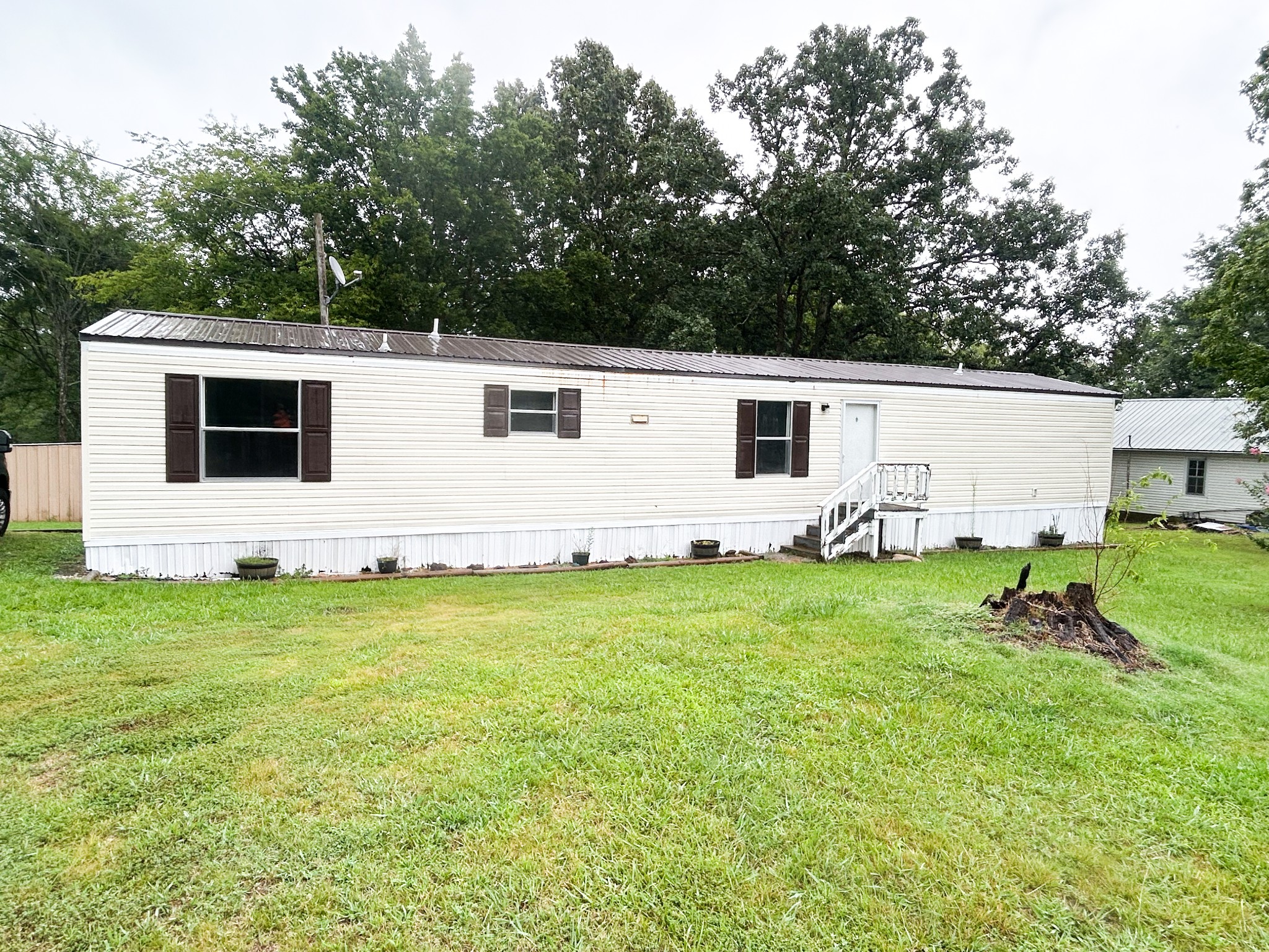 398 2nd Street Big Sandy, TN 38221 - Photo 2 of 26 a view of a backyard with plants and a backyard