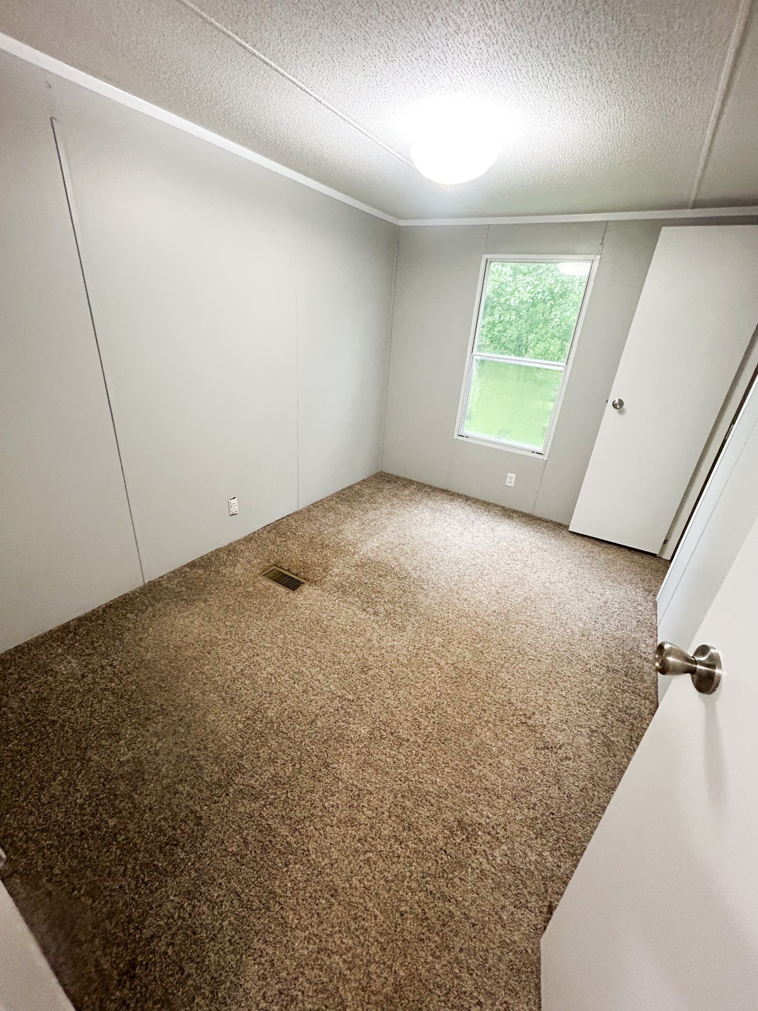 398 2nd Street Big Sandy, TN 38221 - Photo 21 of 26 an empty room with windows