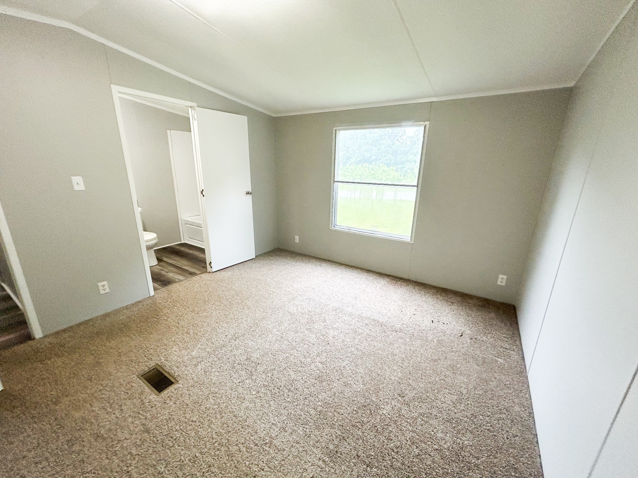 398 2nd Street Big Sandy, TN 38221 - Photo 25 of 26 an empty room with a window