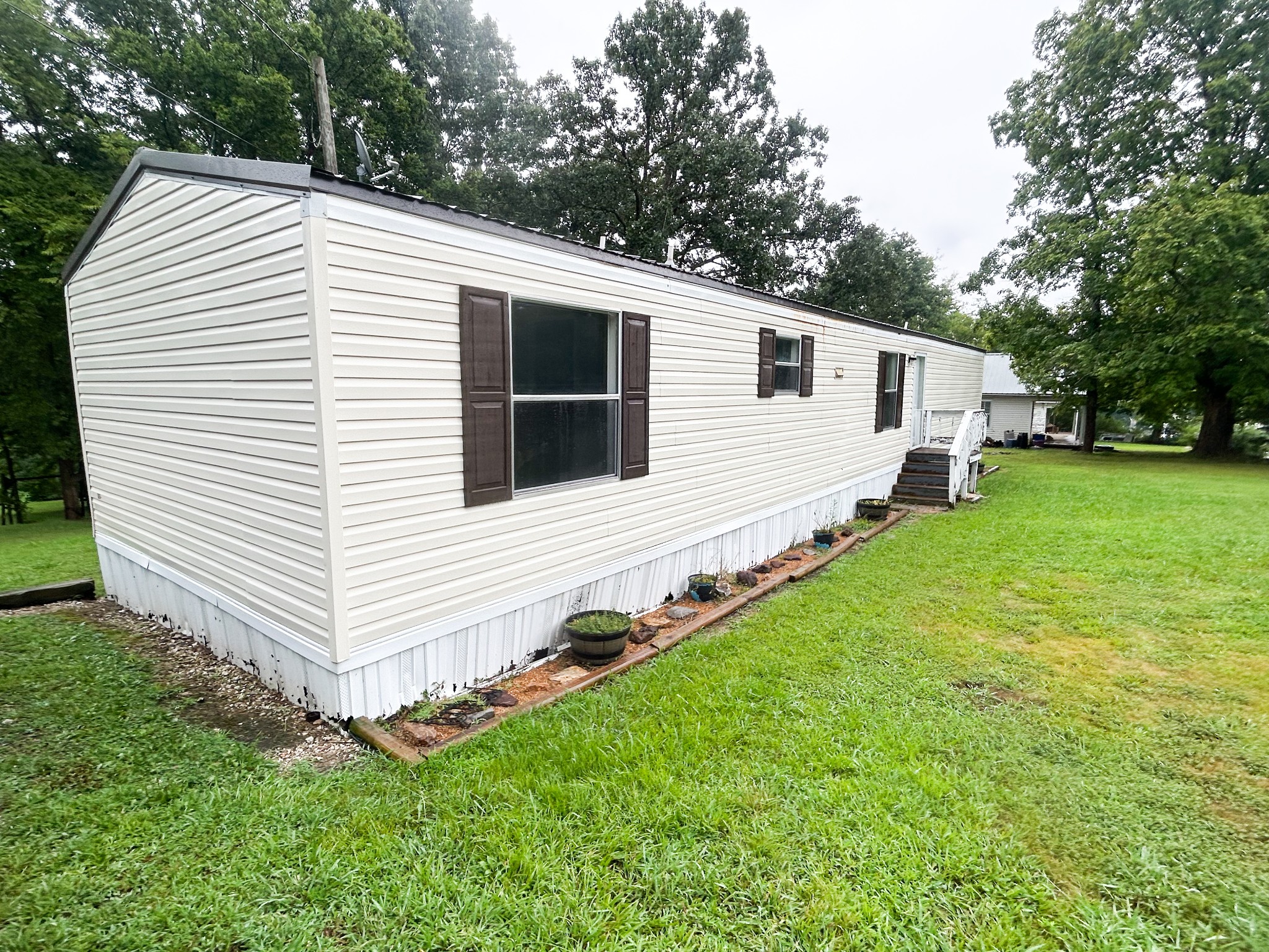 398 2nd Street Big Sandy, TN 38221 - Photo 3 of 26 a view of a house with a backyard