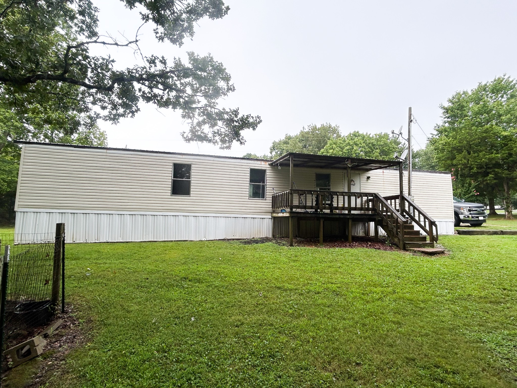 398 2nd Street Big Sandy, TN 38221 - Photo 7 of 26 a view of a house with a yard and sitting area