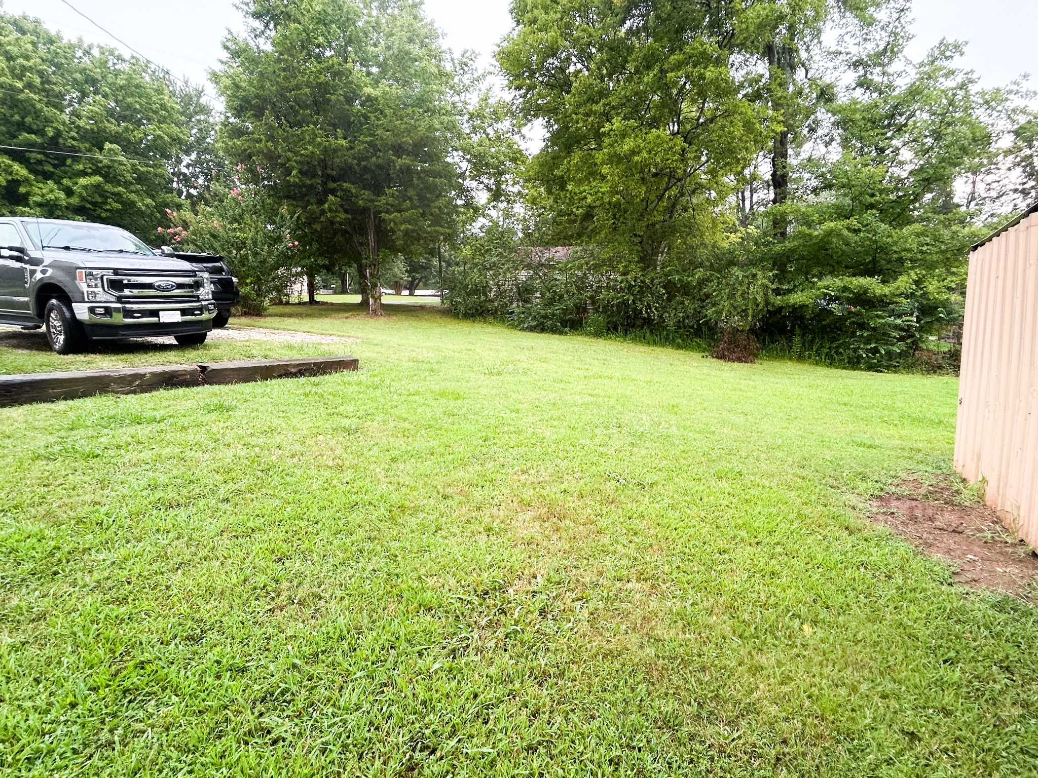 398 2nd Street Big Sandy, TN 38221 - Photo 10 of 26 a view of a street with a car parked in front of it