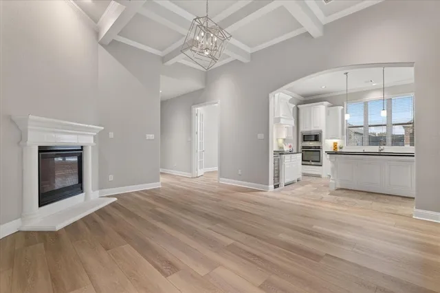 a view of a kitchen with a sink and a refrigerator